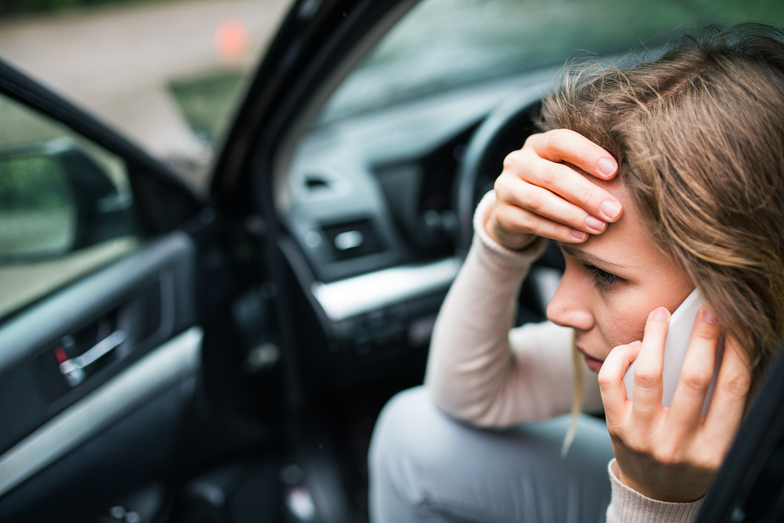 04 05 19 bigstock young woman in the damaged car 258603493