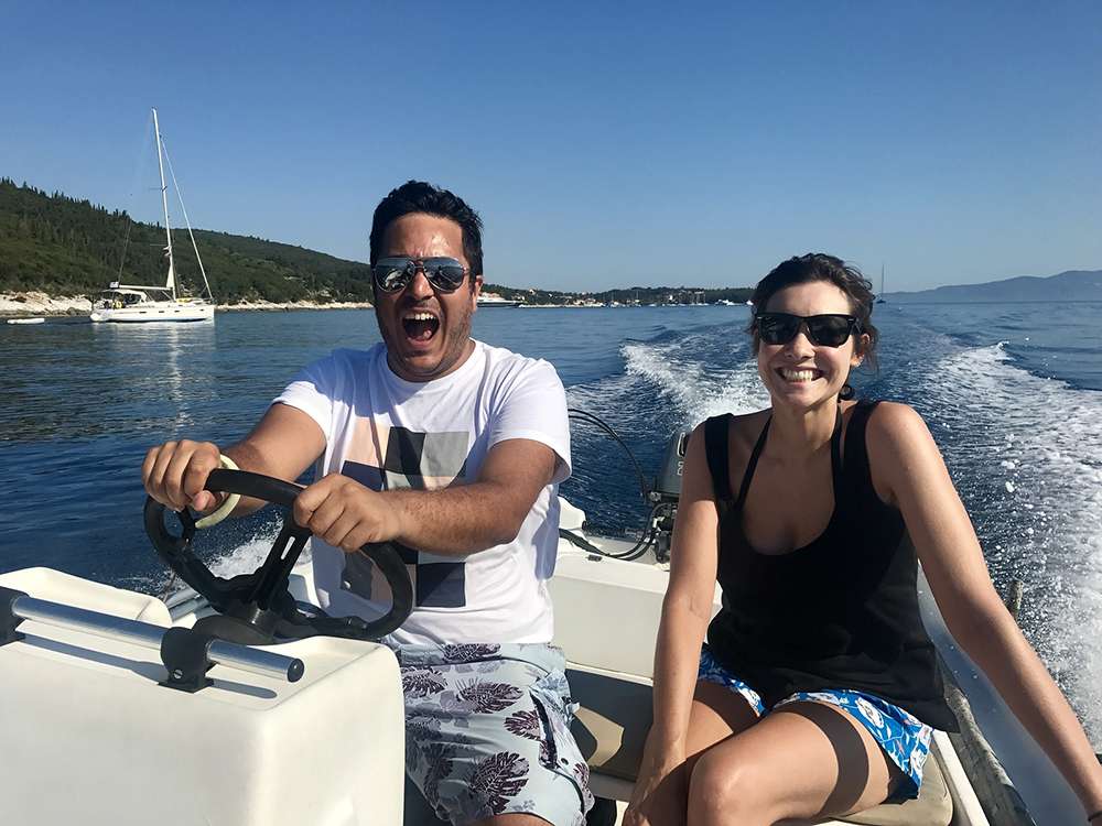 a man and woman enjoying speed boat ride