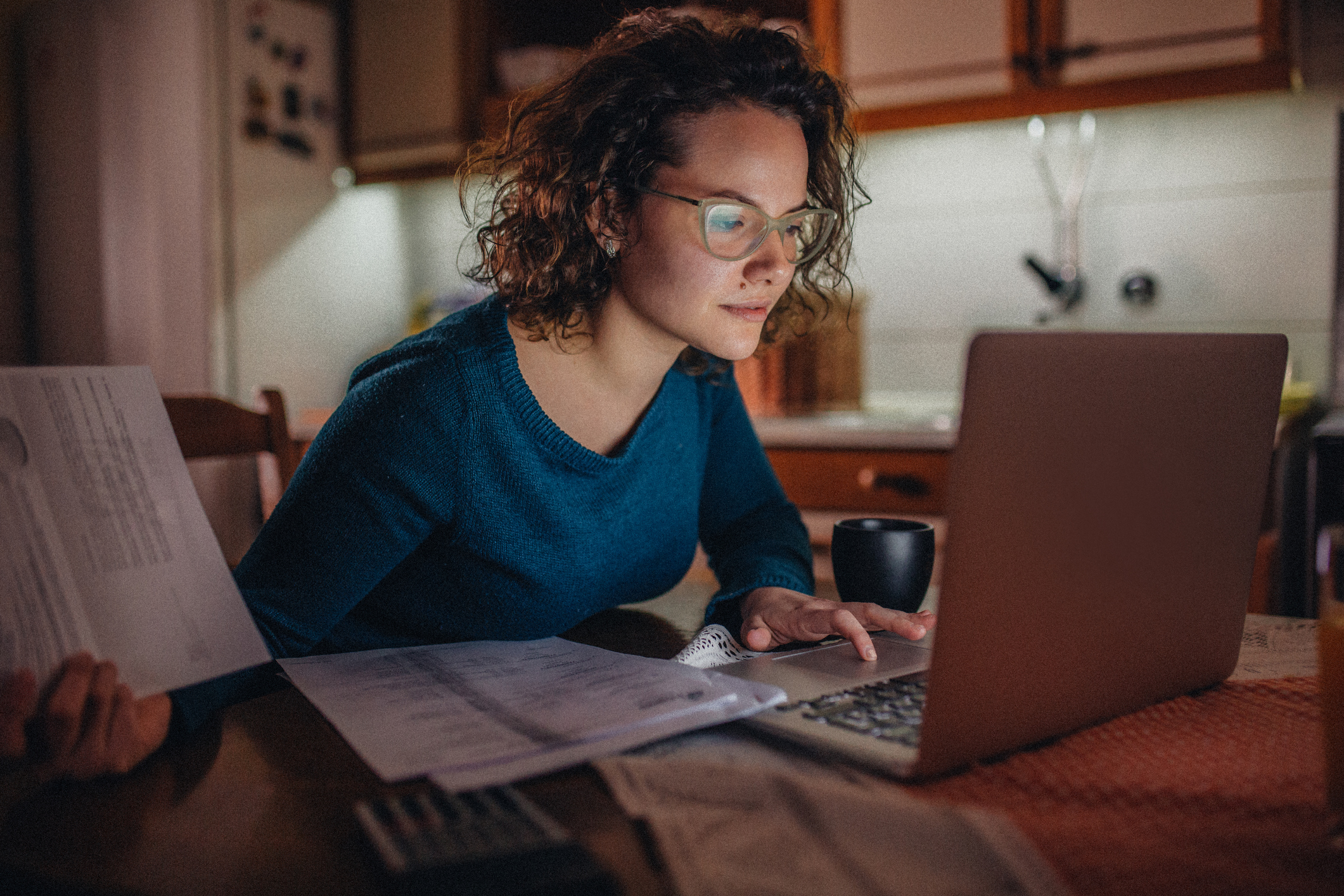 Young woman looking at laptop screen