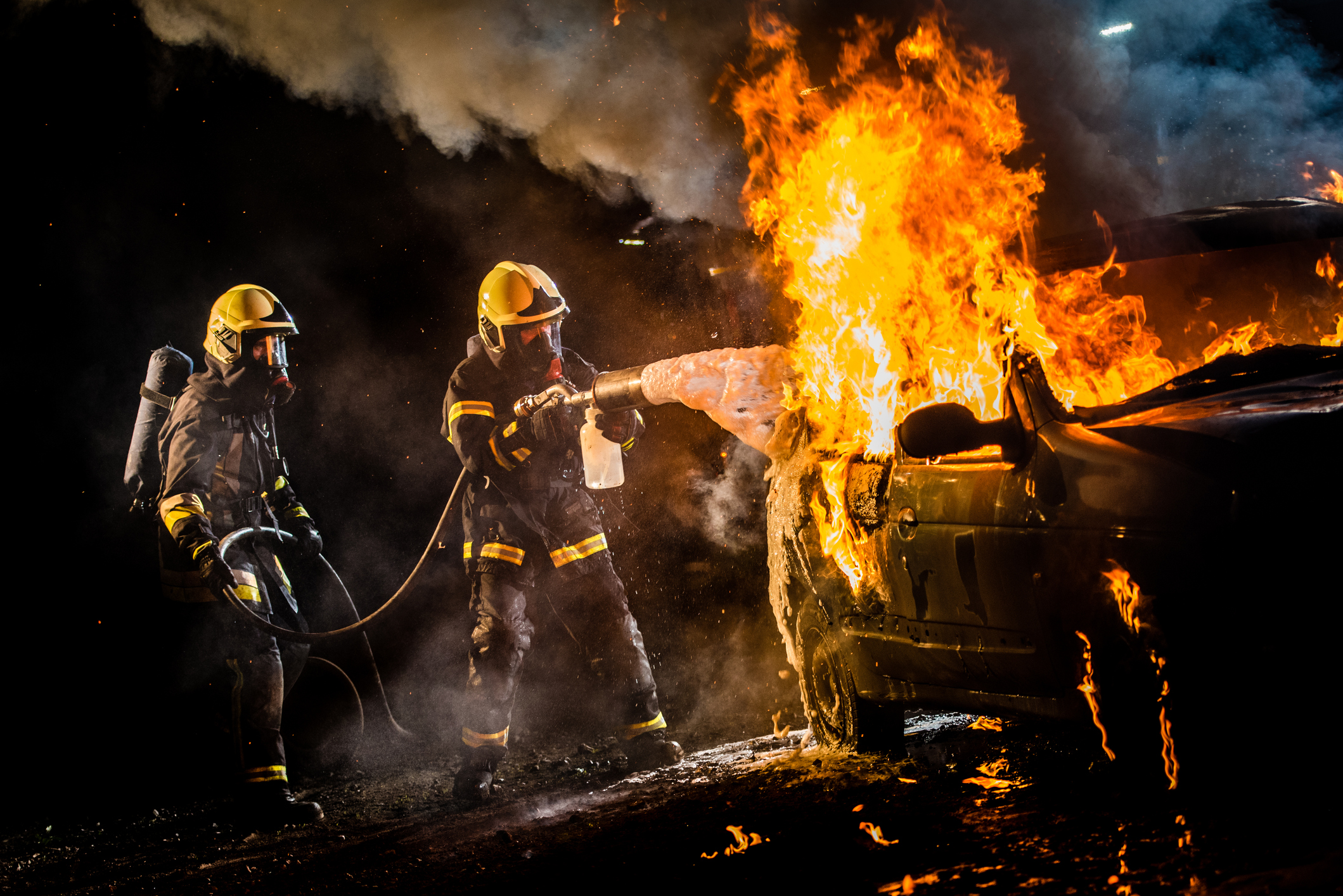 Firefighters Extinguishing fire | electric vehicle accident lawyer