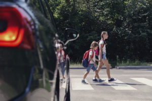 Children walking through pedestrian crossing