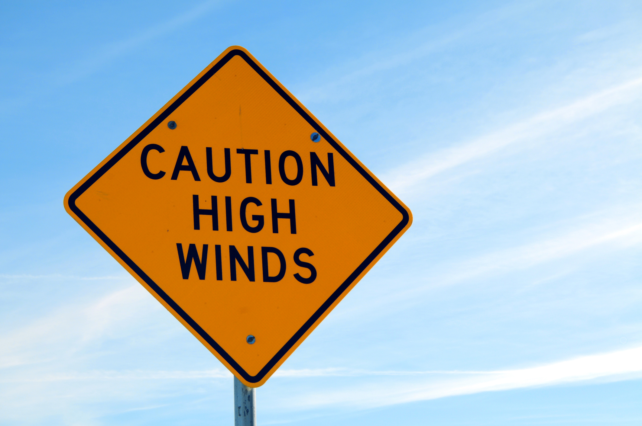 Caution high winds sign