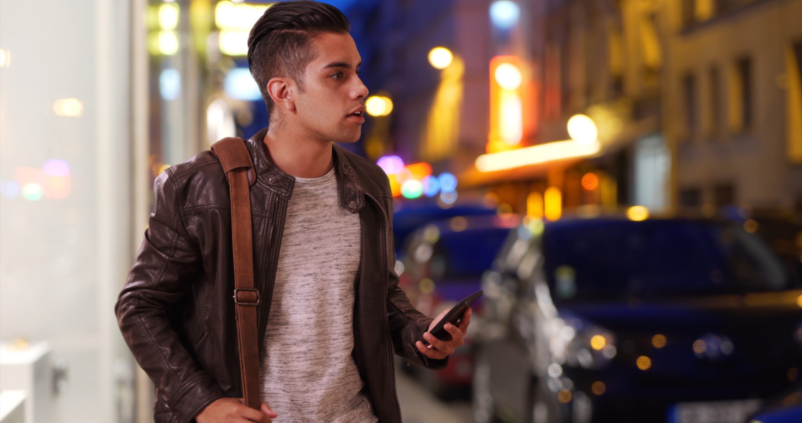 man-looks-for-rideshare-driver