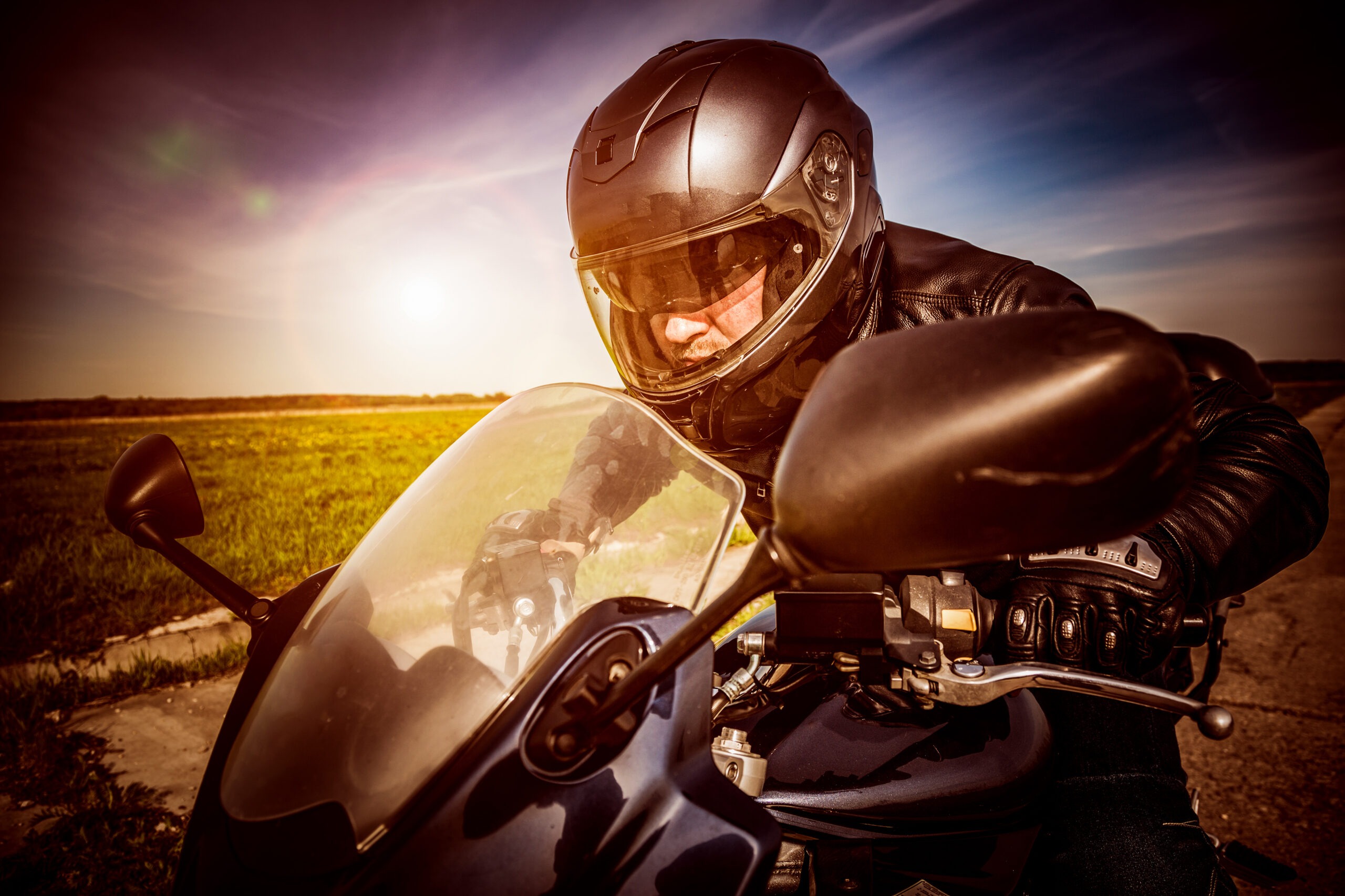 motorcyclist-riding-motorcycle-racing-handlebars
