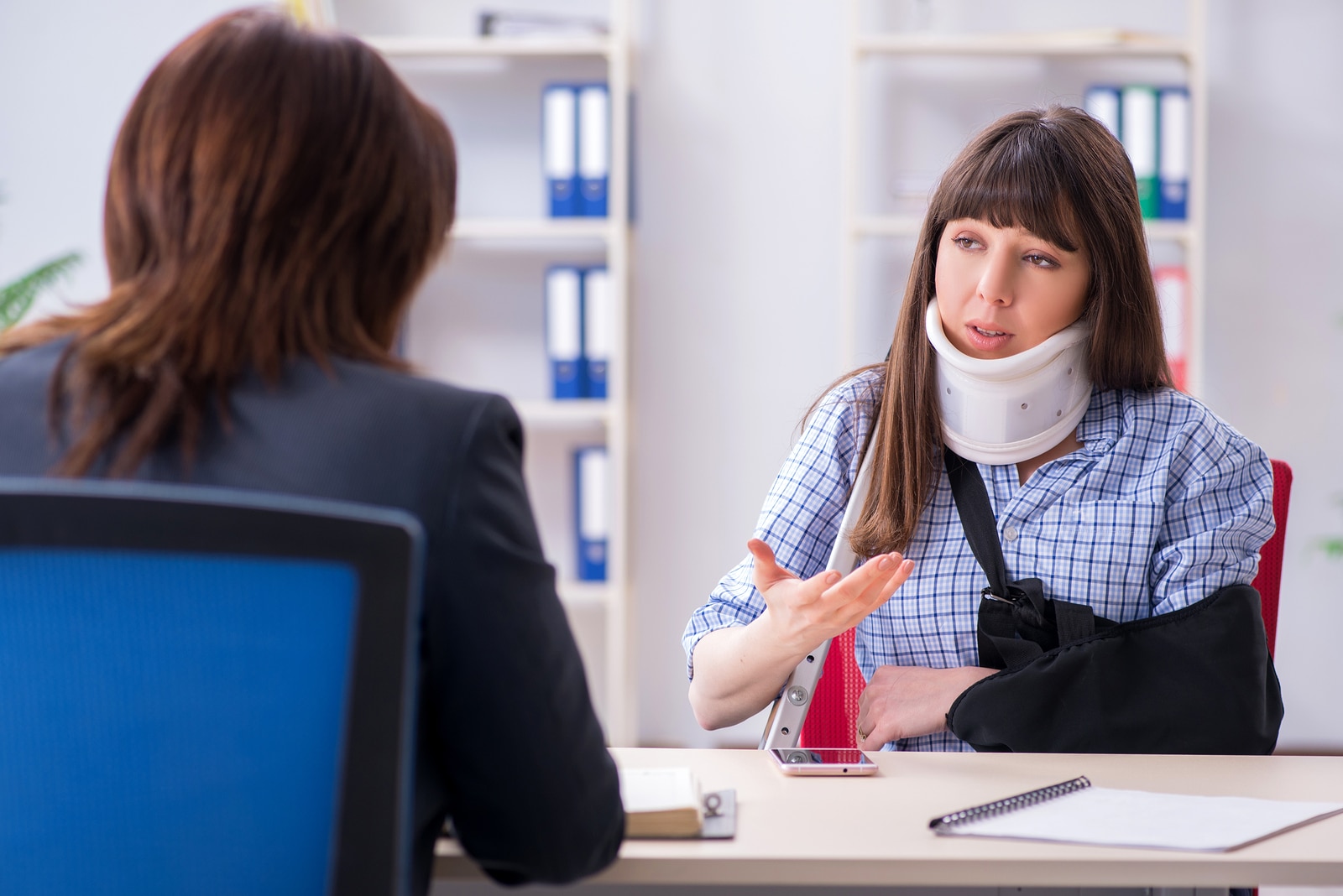 An Injured woman talking to a Lawyer